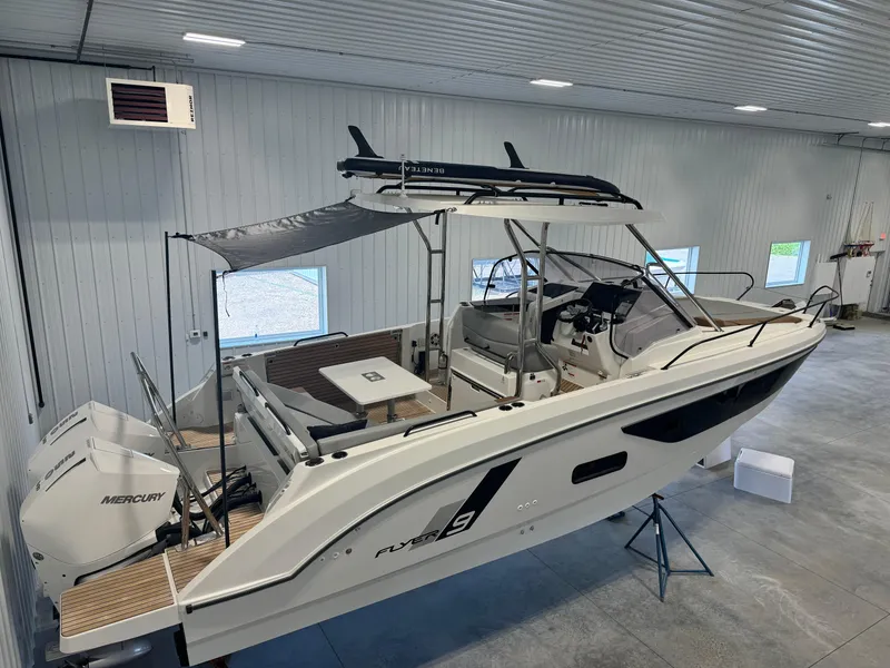 Slide: The Image of 2023 Beneteau Flyer 9 SUNdeck boat in indoor storage. - 2