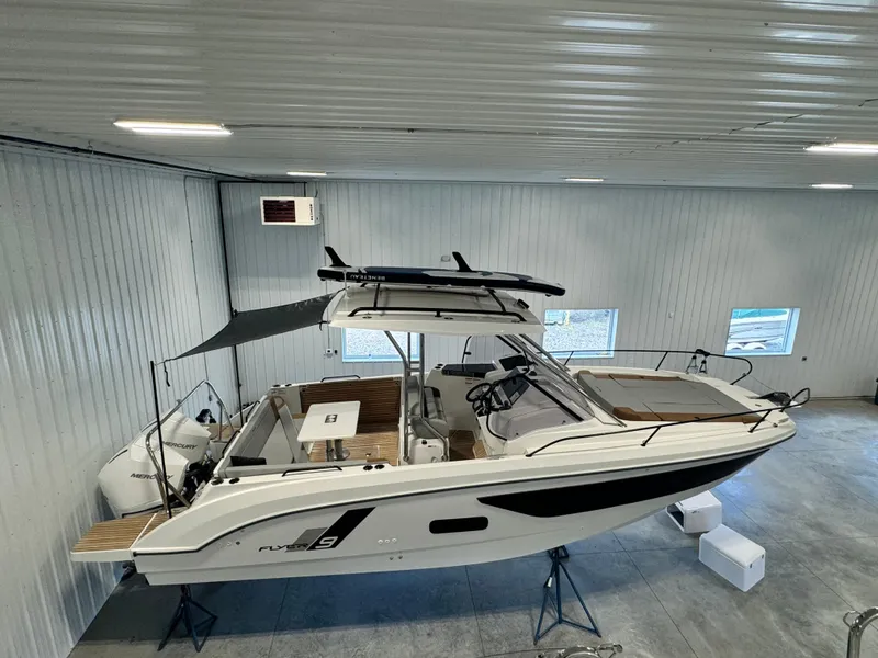Slide: The Image of 2023 Beneteau Flyer 9 SUNdeck boat in indoor storage facility. - 3