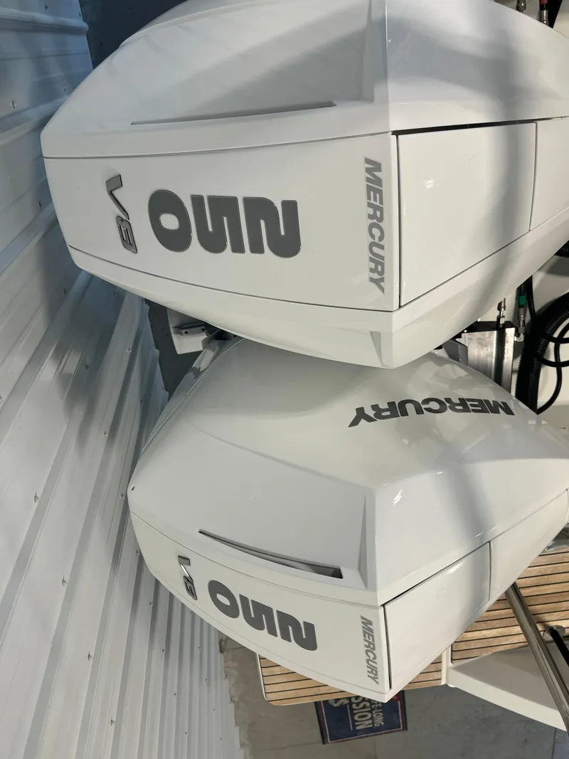 Slide: The Image of Twin Mercury outboard engines on a 2023 Beneteau Flyer 9 SUNdeck boat. - 5