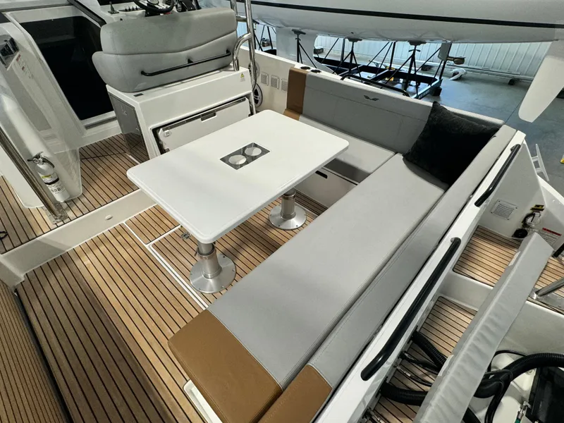 Slide: The Image of 2023 Beneteau Flyer 9 SUNdeck interior with seating and table. - 8