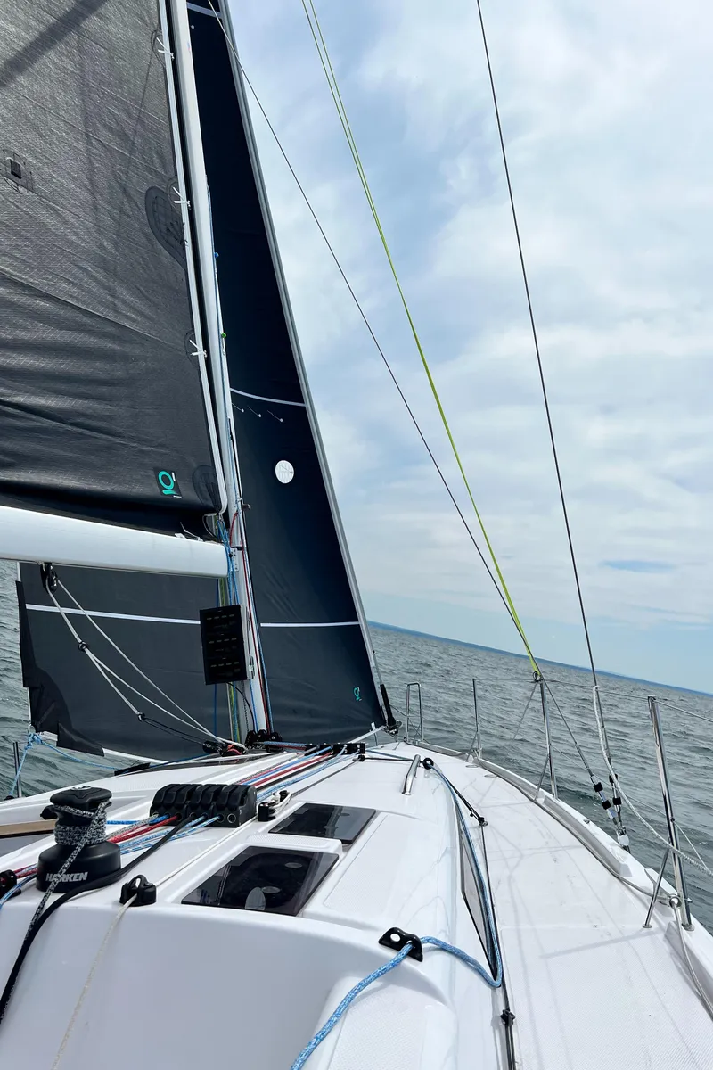 Slide: The Image of 2023 Beneteau First 36 sailing on open water. - 14