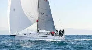 Slide: The Image of 2023 Beneteau First 36 sailboat navigating open waters. - 17