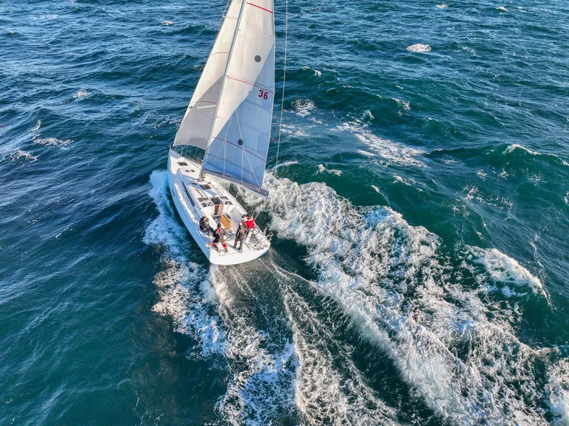 Slide: The Image of 2023 Beneteau First 36 sailboat navigating through ocean waves. - 20