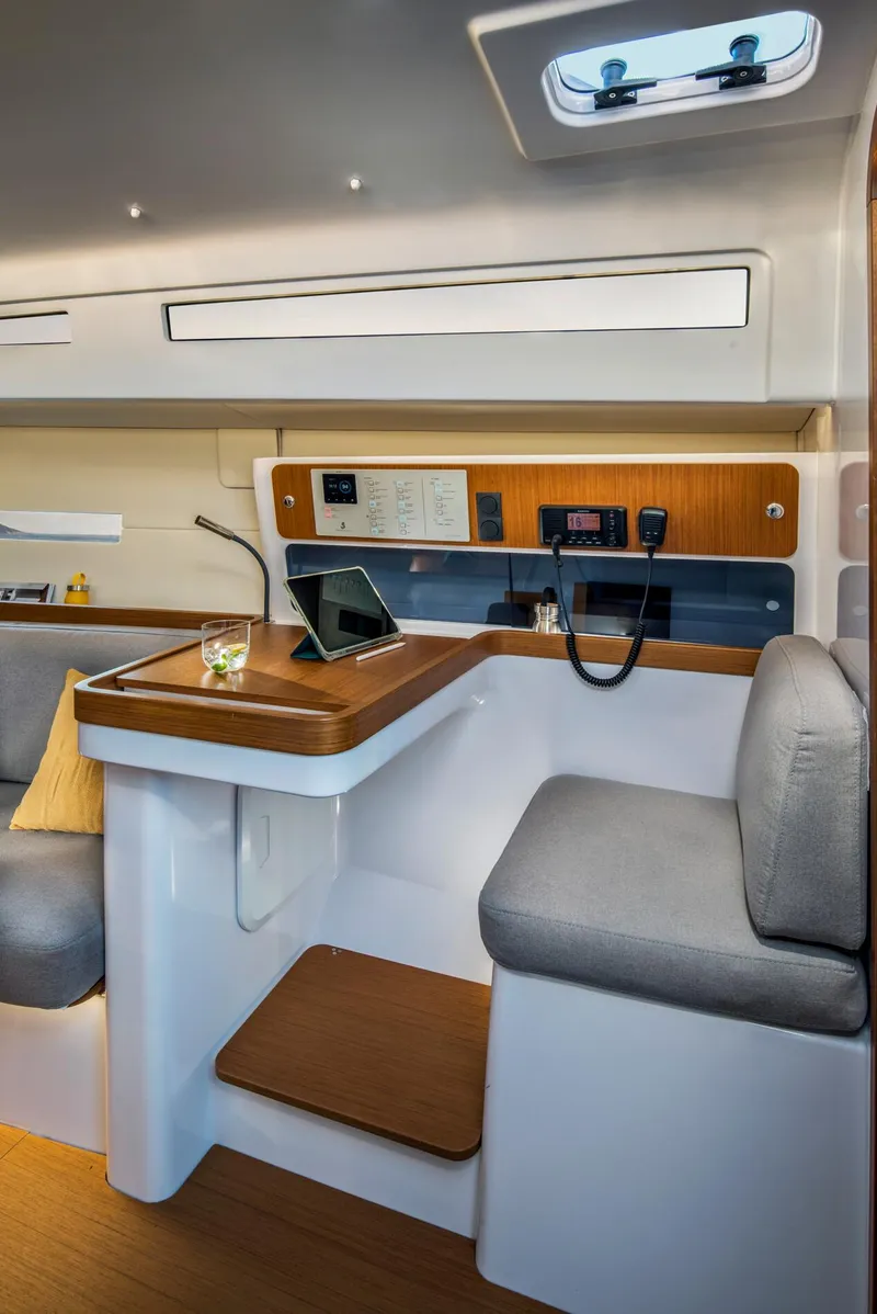 Slide: The Image of 2023 Beneteau First 36 yacht interior with modern navigation station and seating. - 34