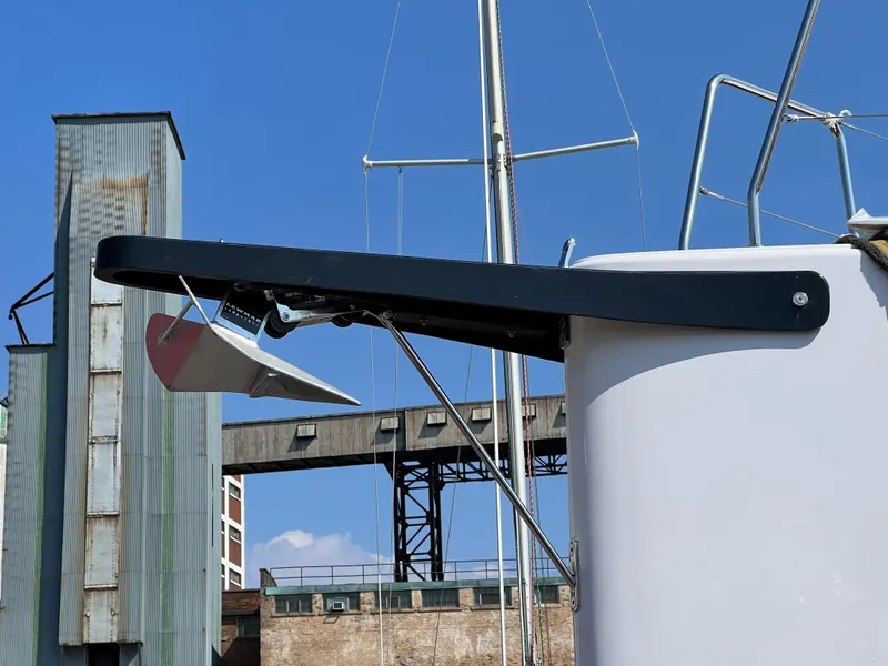 Slide: The Image of 2023 Beneteau First 36 sailboat anchor detail against industrial backdrop. - 39