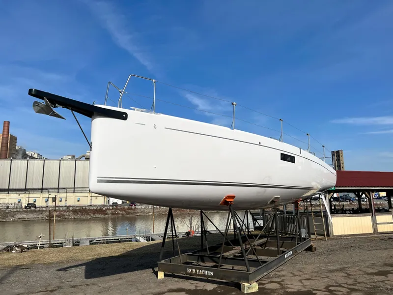 Slide: The Image of 2023 Beneteau First 36 sailboat on display, elevated on a stand. - 41