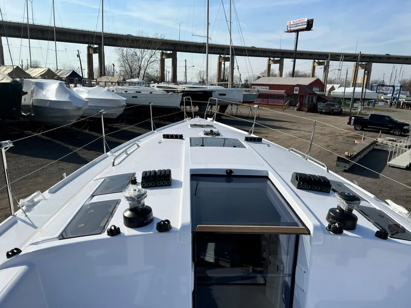 Slide: The Image of 2023 Beneteau First 36 sailboat deck view in marina setting. - 45