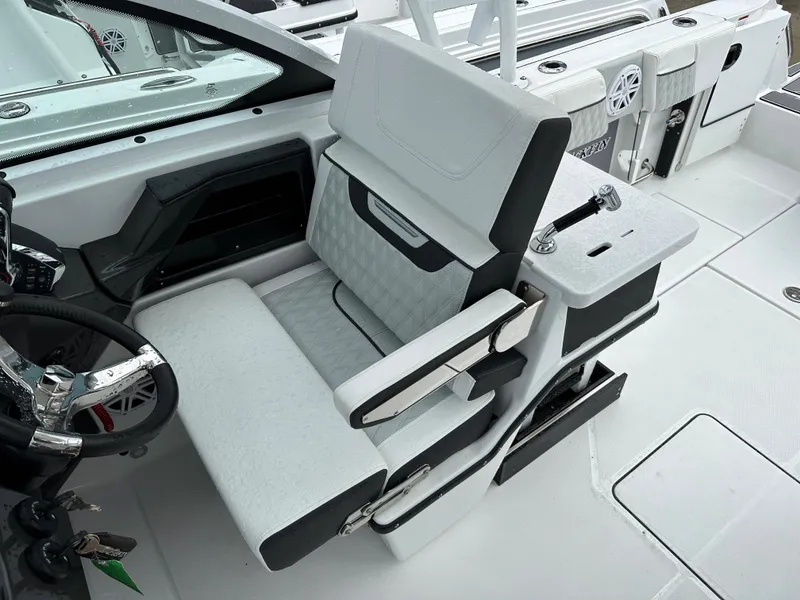 Slide: The Image of 2023 Blackfin 252 DC boat interior with white and black seating. - 10