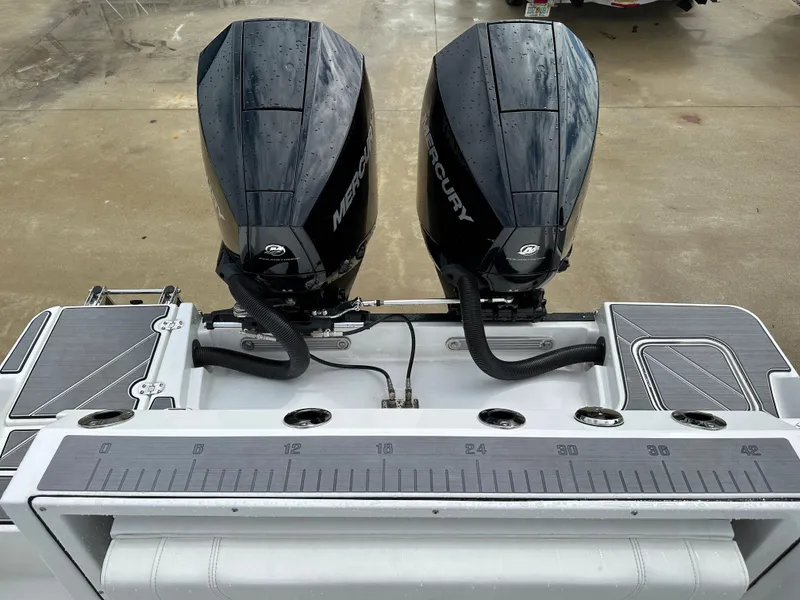 Slide: The Image of 2023 Blackfin 252 DC boat with dual Mercury outboard engines. - 20