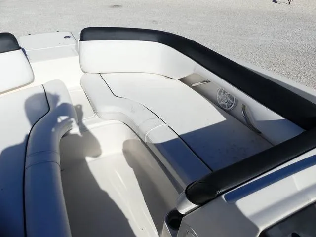 Slide: The Image of 2018 Bayliner 210 Deck Boat interior with white seating and black trim. - 13