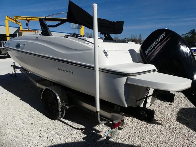 Slide: The Image of 2018 Bayliner 210 Deck Boat on trailer with Mercury outboard motor. - 4