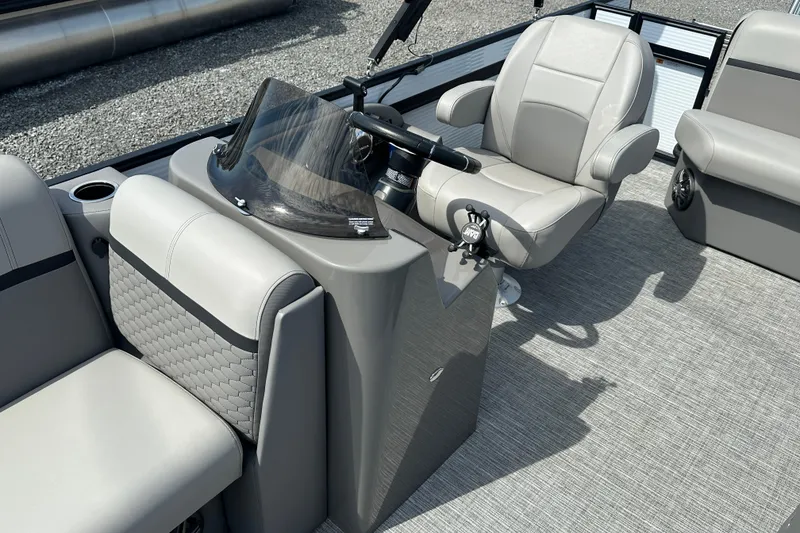 Slide: The Image of 2023 Qwest E-Class 820 Lanai LT boat interior with modern seating and steering console. - 12