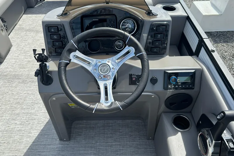 Slide: The Image of 2023 Qwest E-Class 820 Lanai LT boat dashboard with steering wheel and controls. - 14