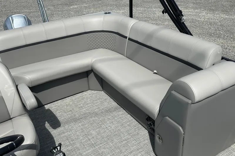 Slide: The Image of 2023 Qwest E-Class 820 Lanai LT boat interior with gray seating and textured flooring. - 16