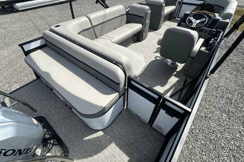 Slide: The Image of 2023 Qwest E-Class 820 Lanai LT pontoon boat interior with seating and steering console. - 18