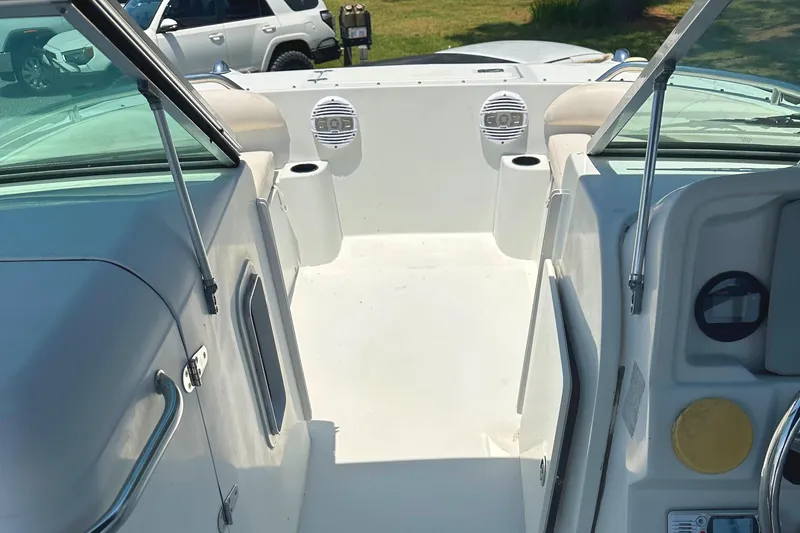 Slide: The Image of 2006 Glacier Bay 2240 Dual Console boat interior with seating and speakers. - 10