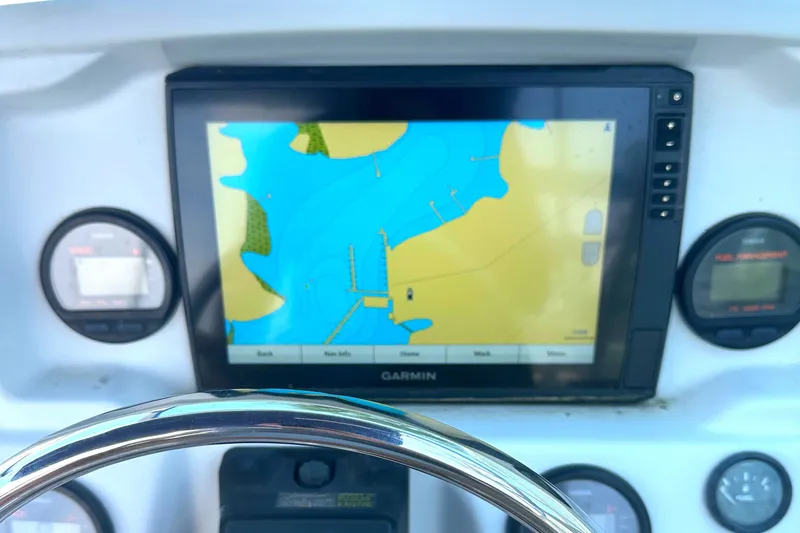 Slide: The Image of Boat dashboard with Garmin GPS on Glacier Bay 2240 Dual Console, 2006 model. - 11