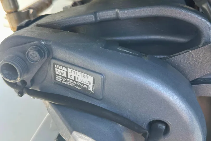 Slide: The Image of Close-up of a Yamaha motor part on a 2006 Glacier Bay 2240 Dual Console boat. - 20