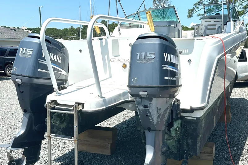 Slide: The Image of 2006 Glacier Bay 2240 Dual Console boat with twin Yamaha 115 engines on display. - 3