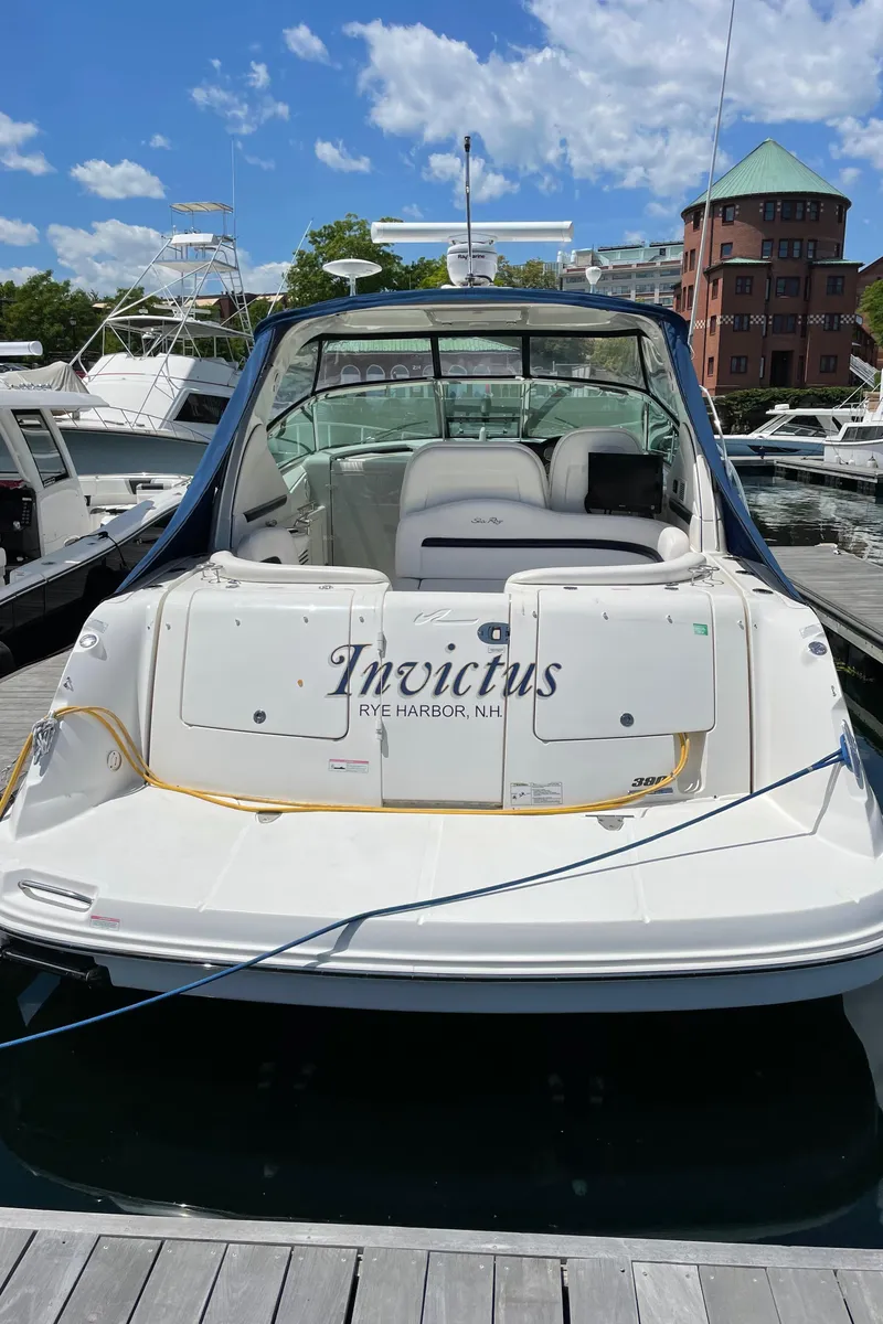 Slide: The Image of 2011 Sea Ray 390 Sundancer docked at marina under blue sky. - 13