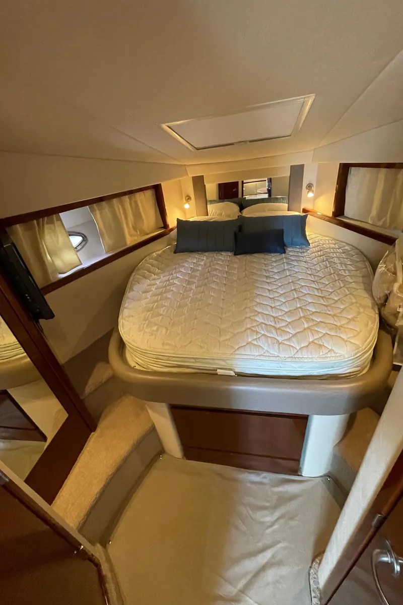 Slide: The Image of Luxurious cabin interior of 2011 Sea Ray 390 Sundancer yacht with cozy bed. - 48