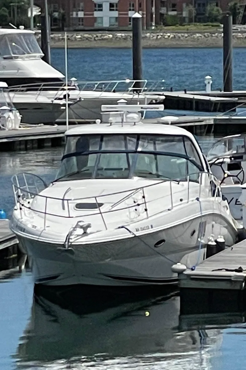 Slide: The Image of 2011 Sea Ray 390 Sundancer docked at marina, sleek design, luxury yacht. - 7