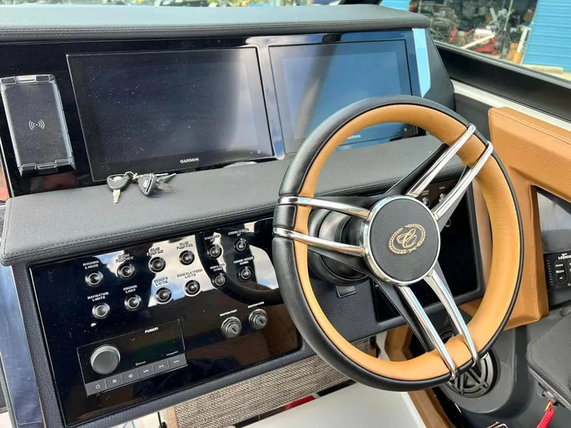 Slide: The Image of Dashboard of a 2023 Cobalt R33 boat with steering wheel and control panel. - 3