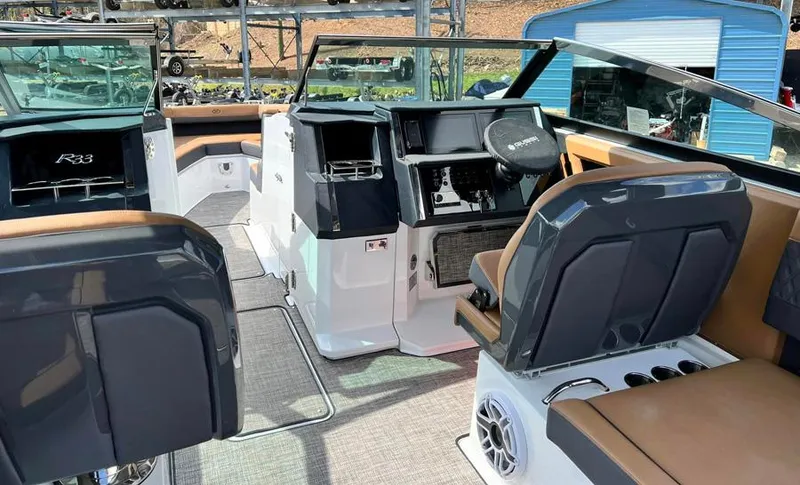Slide: The Image of Interior of 2023 Cobalt R33 boat with modern dashboard and seating. - 4