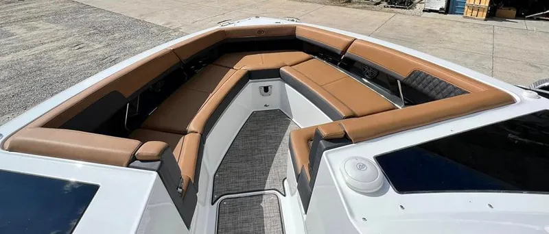 Slide: The Image of 2023 Cobalt R33 boat with spacious tan seating and modern design. - 6