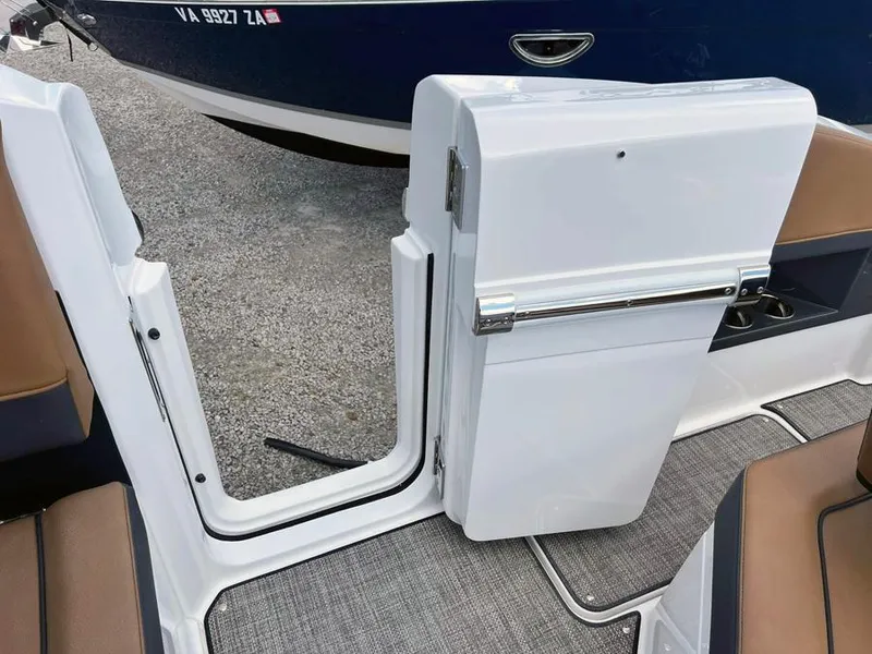 Slide: The Image of 2023 Cobalt R33 boat with open side door and interior view. - 8