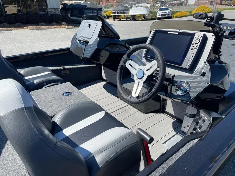Slide: The Image of 2023 Vexus AVX 2080 boat interior with steering wheel and navigation system. - 10