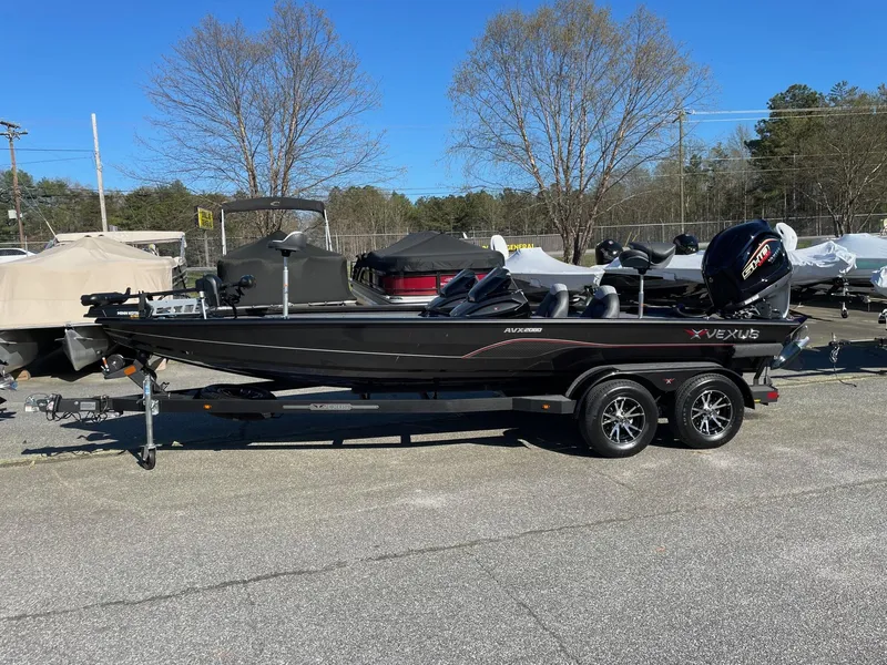 Slide: The Image of 2023 Vexus AVX 2080 black fishing boat on trailer in outdoor lot. - 3