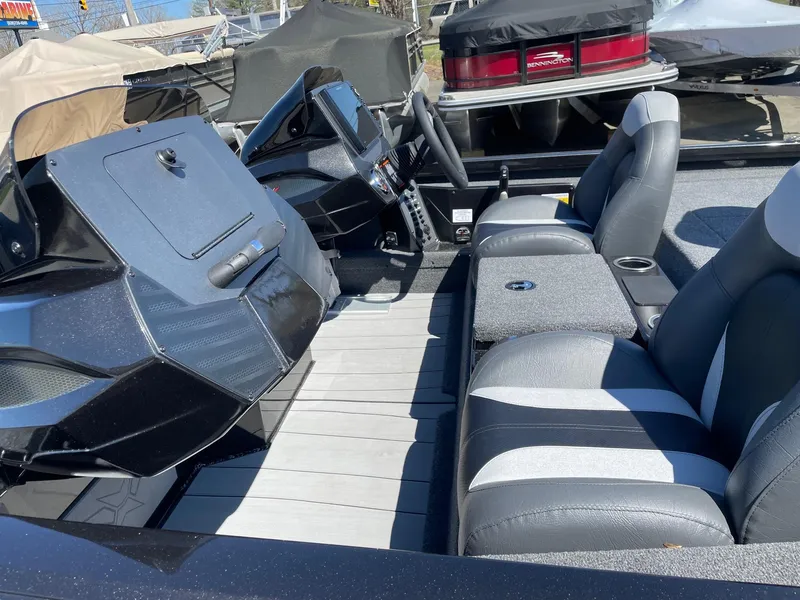 Slide: The Image of 2023 Vexus AVX 2080 boat interior with dual seats and steering console. - 9