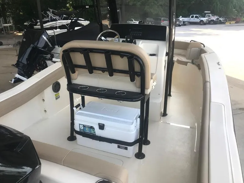 Slide: The Image of 2023 Scout 215 XSF boat interior with seating and cooler. - 5