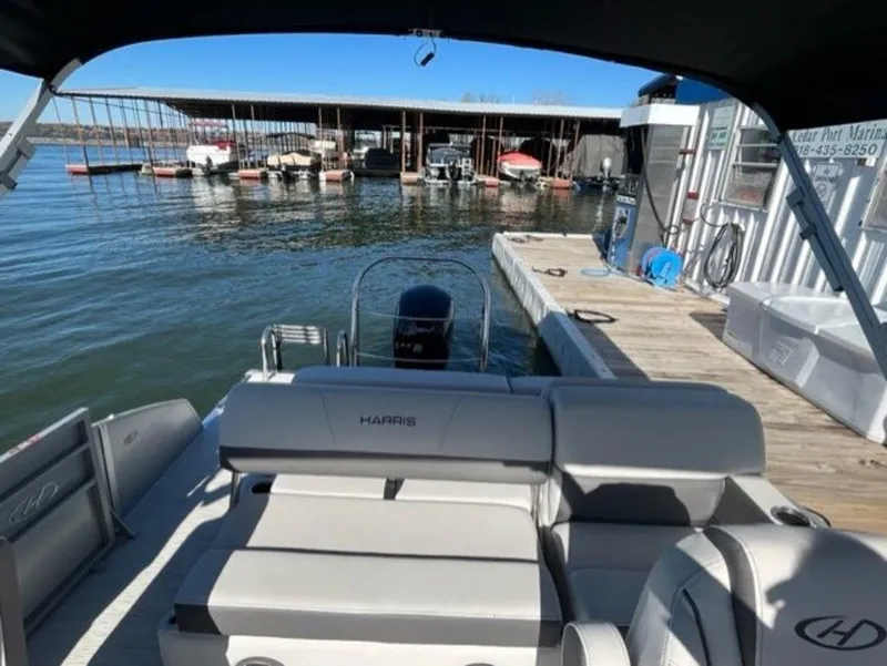 Slide: The Image of 2023 Harris CRUISER 230 SLDH pontoon boat docked at marina. - 3