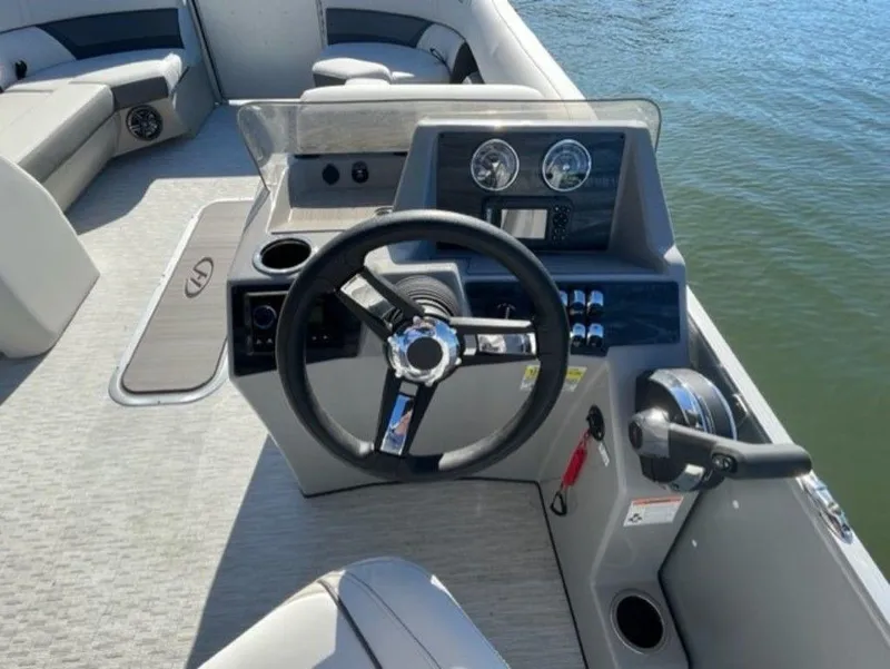 Slide: The Image of 2023 Harris CRUISER 230 SLDH boat steering console with modern controls. - 4