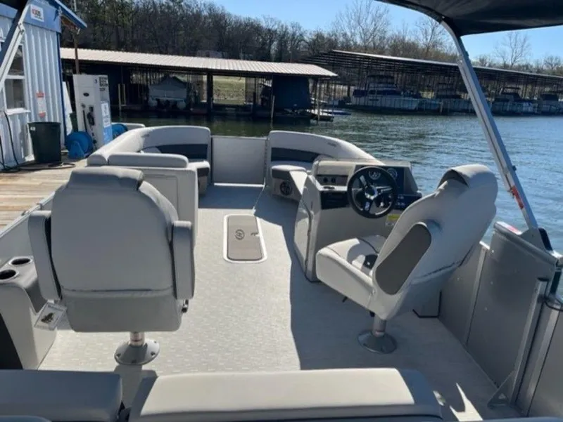 Slide: The Image of 2023 Harris CRUISER 230 SLDH pontoon boat interior with seating and steering console. - 6