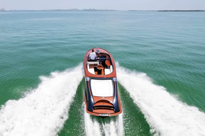 Slide: The Image of Riva Aquariva Super 2020 luxury speedboat cruising on open water. - 4