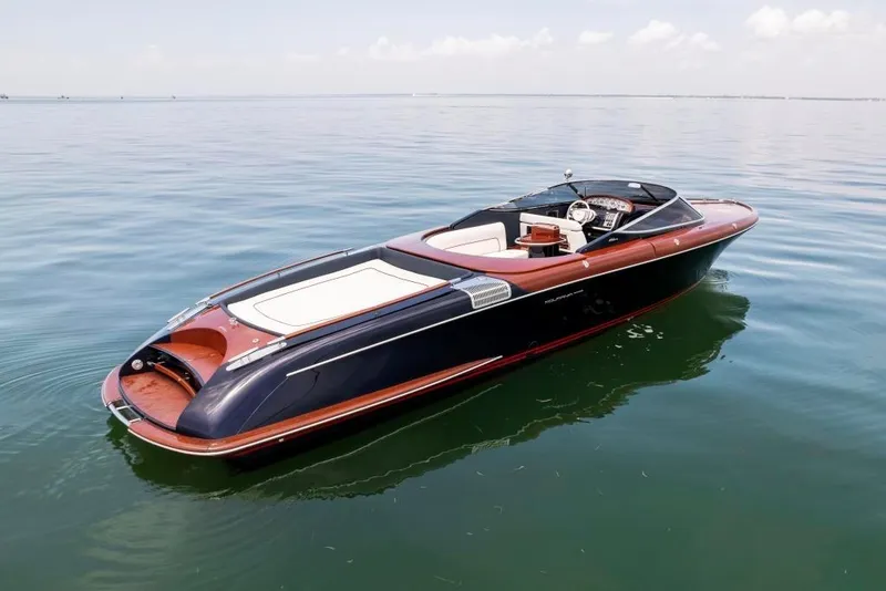 Slide: The Image of 2020 Riva Aquariva Super luxury speedboat on calm water. - 9