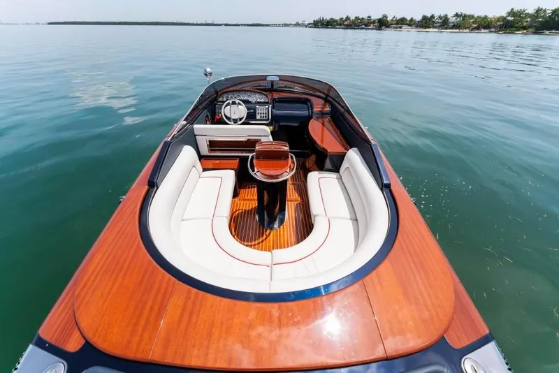 Slide: The Image of 2020 Riva Aquariva Super luxury boat with elegant wooden deck and white seating. - 12