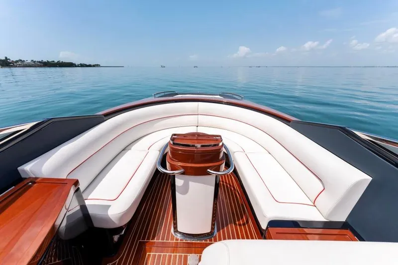 Slide: The Image of Luxurious 2020 Riva Aquariva Super yacht interior with white seating and wooden accents. - 15