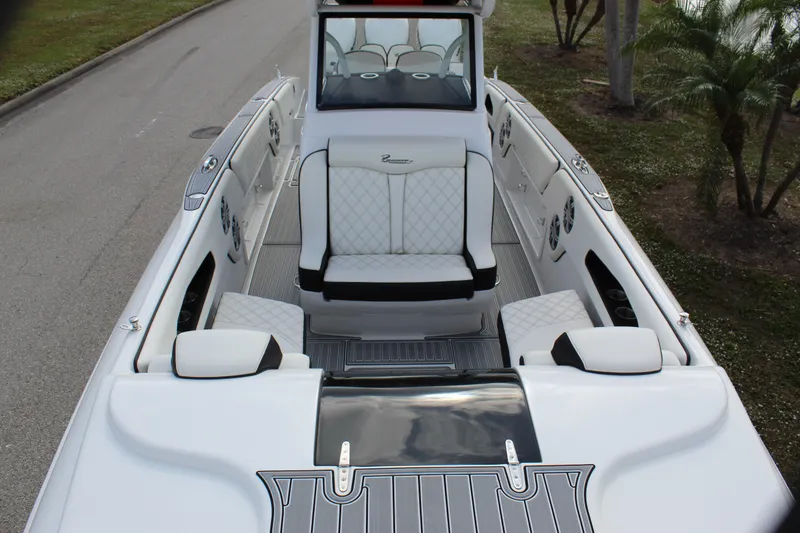 Slide: The Image of 2019 Renegade 33 Cuddy boat interior with white seating and sleek design. - 19