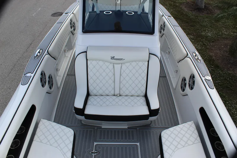 Slide: The Image of 2019 Renegade 33 Cuddy boat interior with white quilted seating and sleek design. - 22