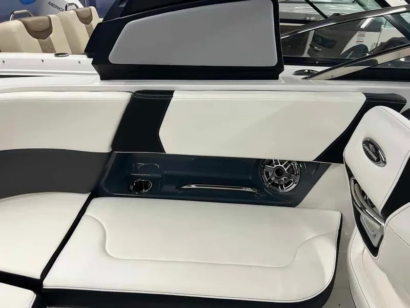 Slide: The Image of Interior seating of 2023 Chaparral 270 OSX boat with white and black upholstery. - 10