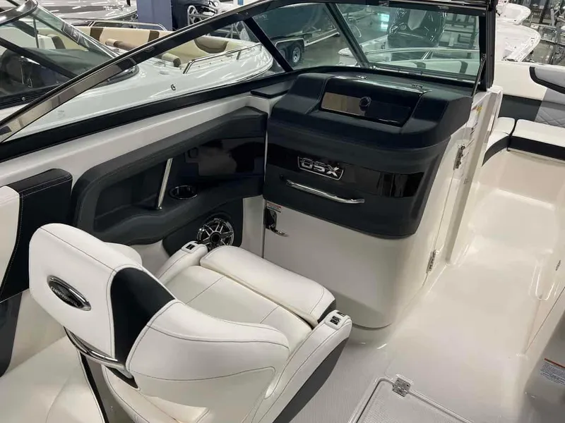 Slide: The Image of 2023 Chaparral 270 OSX boat interior with white and black seating. - 11