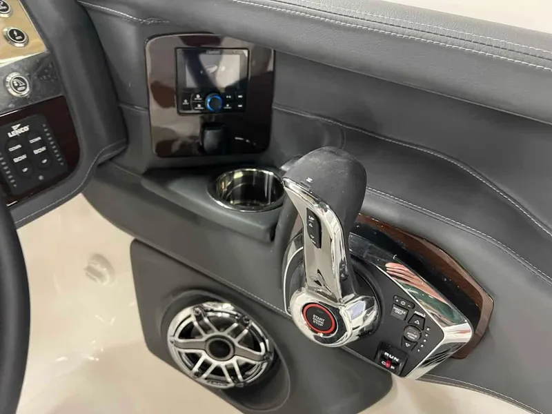 Slide: The Image of Control panel and throttle of 2023 Chaparral 270 OSX boat. - 13