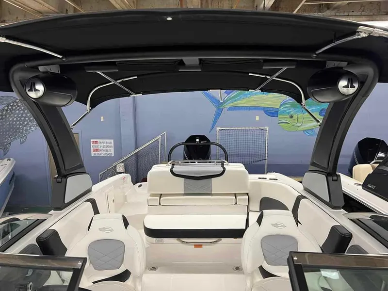 Slide: The Image of 2023 Chaparral 270 OSX boat interior with seating and speakers. - 15