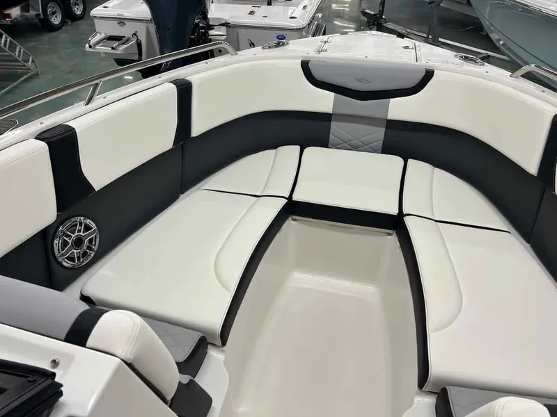 Slide: The Image of 2023 Chaparral 270 OSX boat interior with white and black seating. - 17