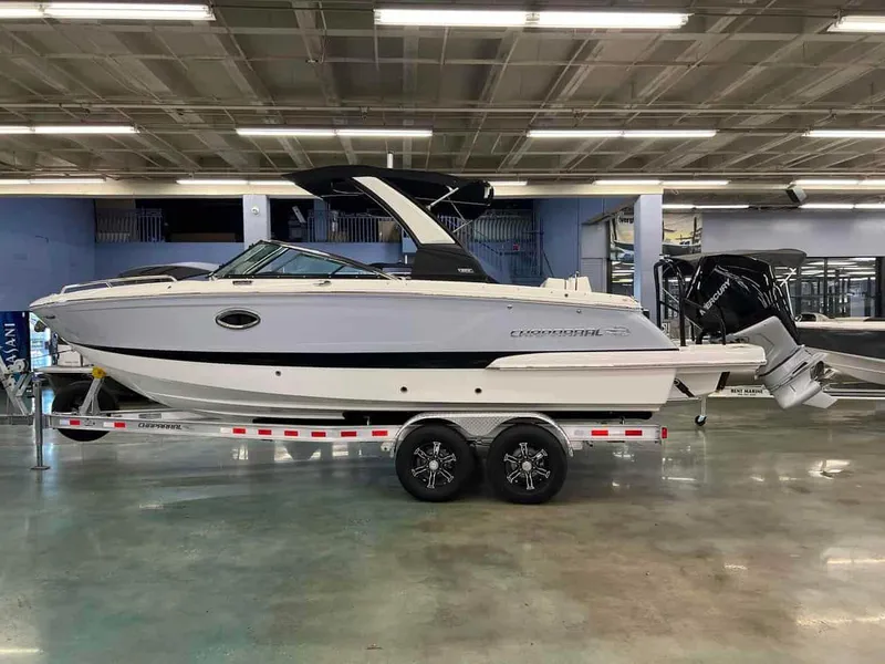 Slide: The Image of 2023 Chaparral 270 OSX boat on a trailer in a showroom. - 4