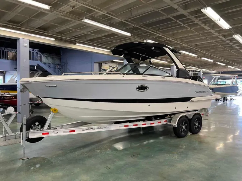 Slide: The Image of 2023 Chaparral 270 OSX boat on trailer in indoor showroom. - 5